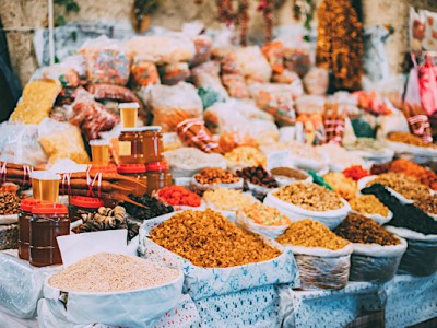 Tbilisi, Georgia. Market Bazar Abundant Counter Of Dried Fruit And Jars Of Honey On Sale.